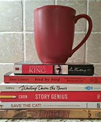 Mug on top of writing craft books